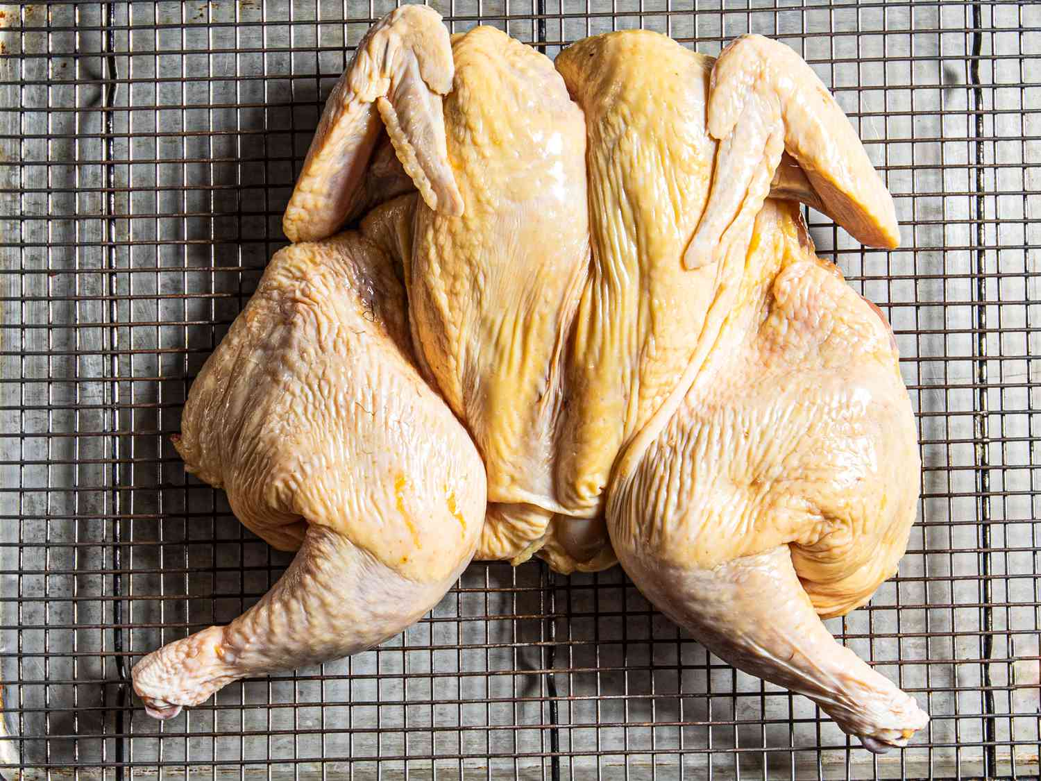 Spatchcocked Chicken on a wire rack