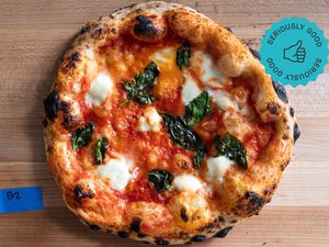 a pizza on a cutting board