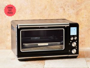 breville oven on terracotta tiles with tan backdrop