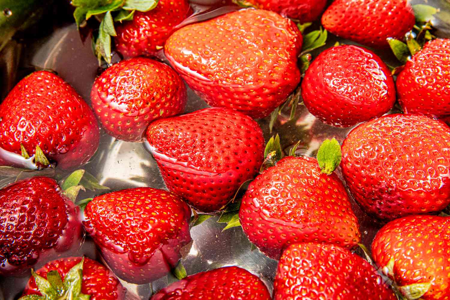 Strawberries submerged in water