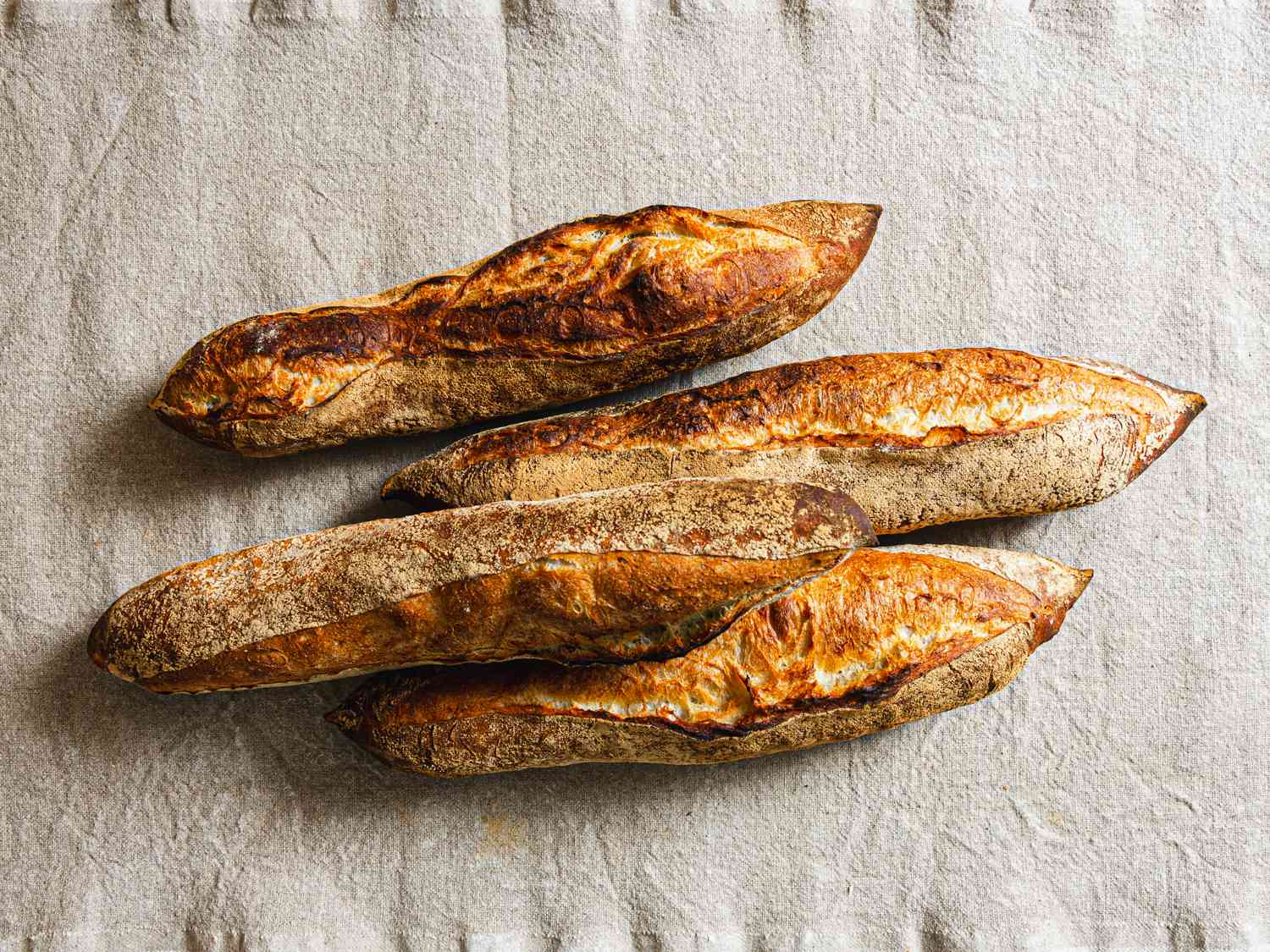 Three baguettes on a cloth