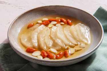 Sliced thawed frozen pears with goji berries and almonds