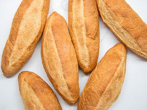 Overhead view of 6 banh mi bread loafs