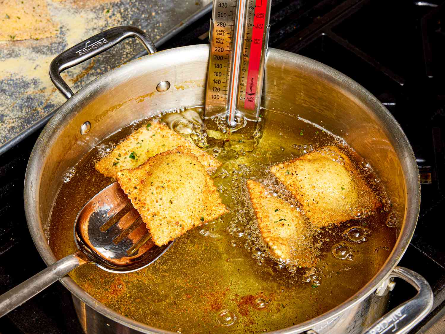 Overhead view of frying raviolis