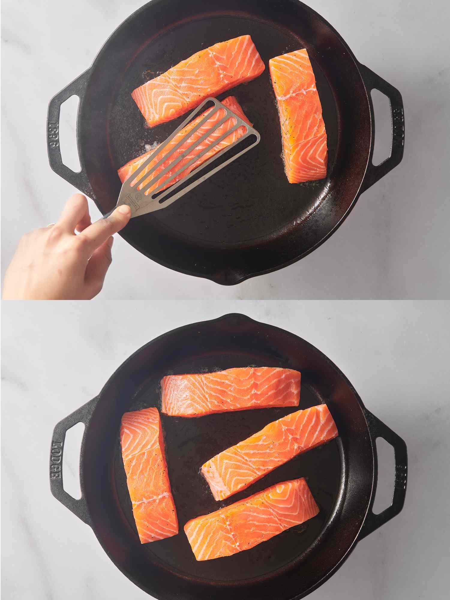 Using the back of a flexible spatula to press salmon firmly in place, and four fillets cooking inside pan