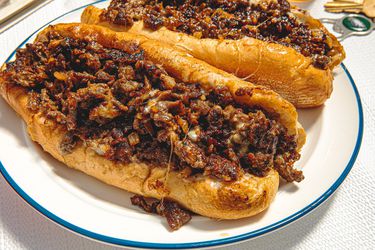 Overhead view of two cheesesteaks