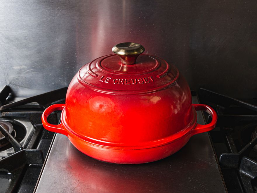 a red Le Creuset bread oven