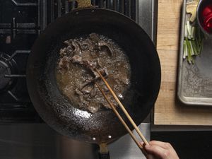 Overhead view of beef being dry-fried