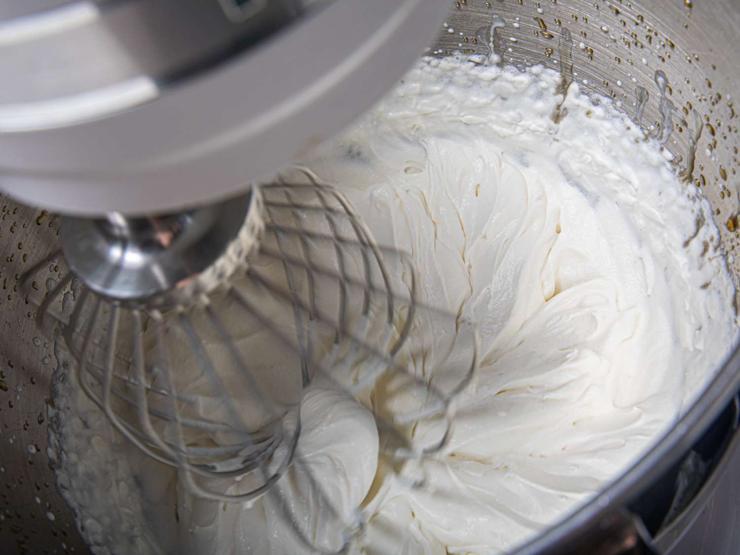 Cream being whipped in a stand mixer