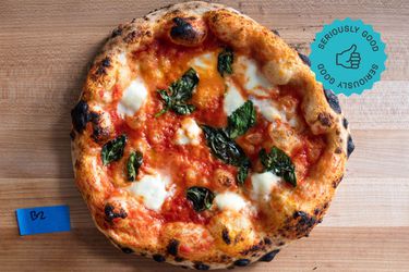 a pizza on a cutting board