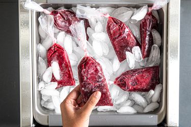 Overhead view of picking a boli out of a freezer