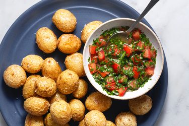 Aji­ (Colombian-Style Tomato and Onion Salsa) in a bowl, served with potatoes