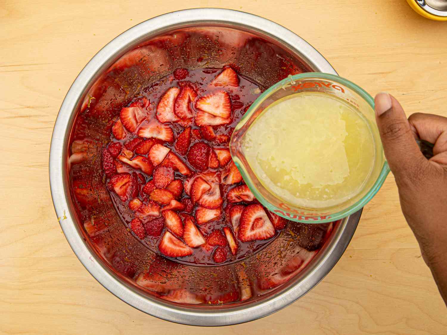 Overhead view of adding lemon juice