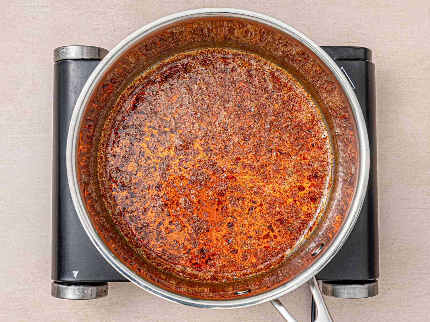 Butter in a pan infused with paprika