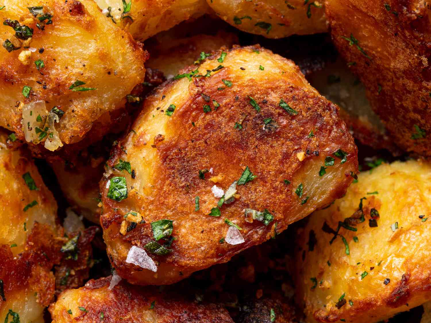 A close up of the crispy roast potatoes showing off the micro blistering on the surface.