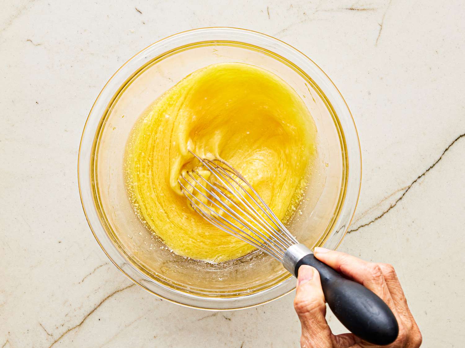 Overhead view of whisking egg mixture