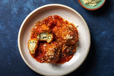 Overhead view of albondigas de ricotta on a blue background