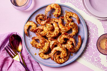 Cajun shrimp on a purple plate.