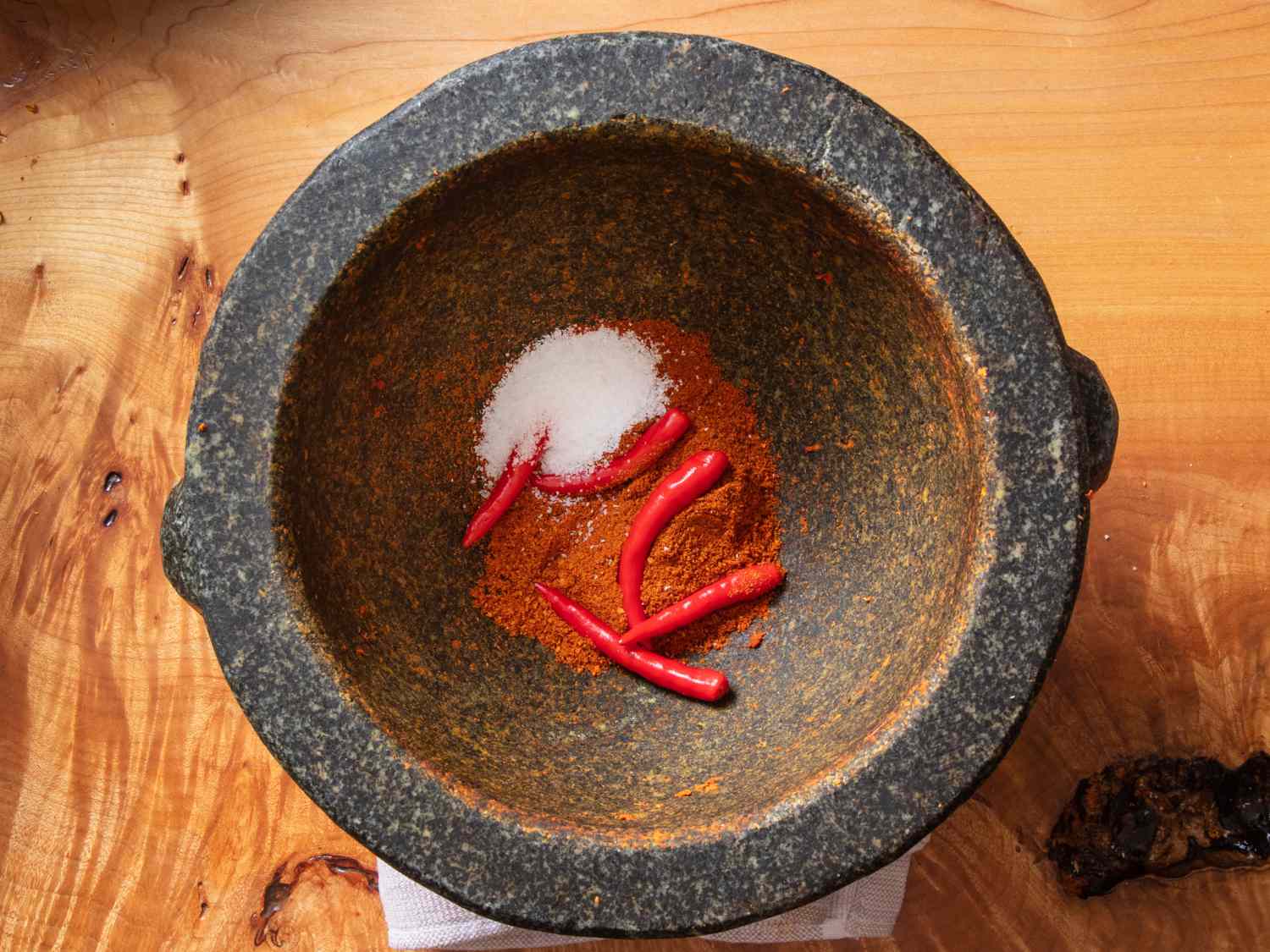 ground dried chiles, fresh chiles, and salt in a mortar and pestle