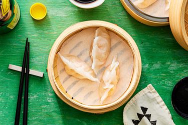 Overhead view of dumplings in steamer