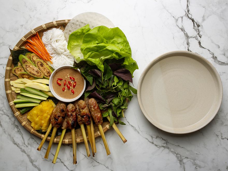 nem lui platter with a bowl of warm water alongside