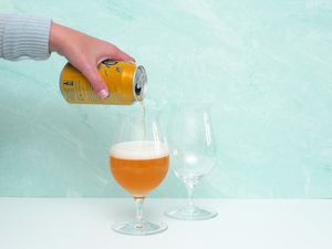 pouring beer into tulip glass