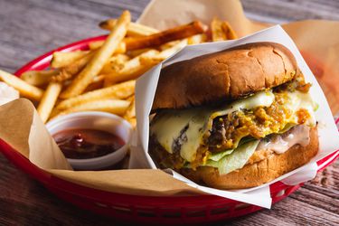 copycat In-and-Out burger in a basket with fries and ketchup