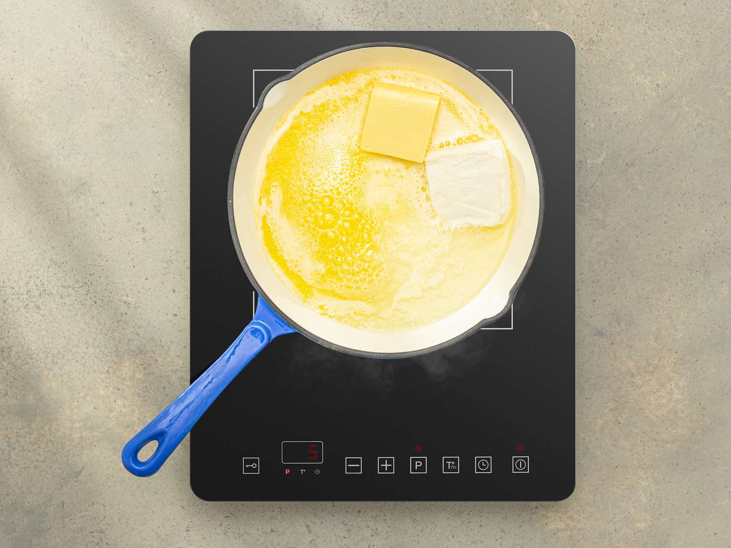 Overhead view of butter and shortening in a pan