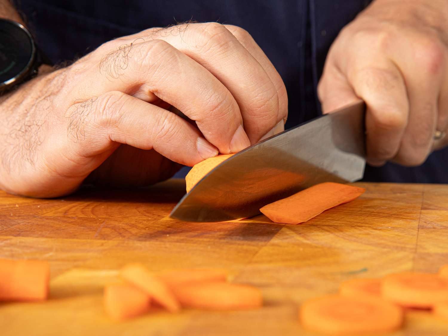 Side view of cutting a carrot