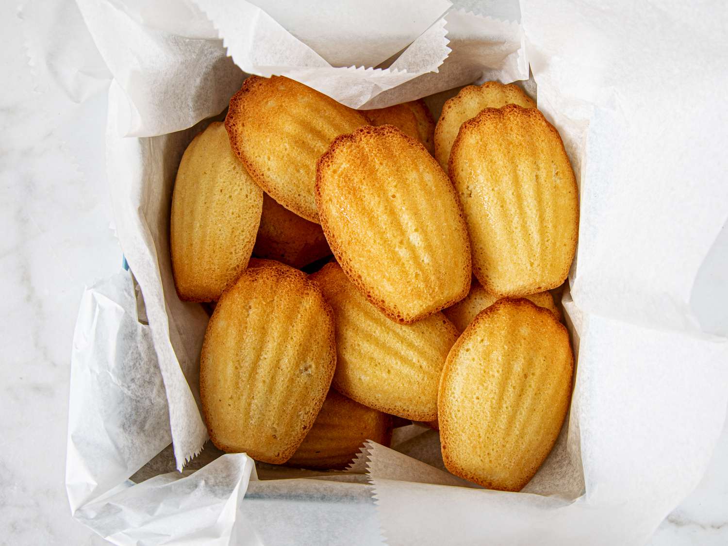 Overhead view of madeleines in box