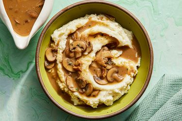 Overhead view of mushroom gravy poured on top of potatoes