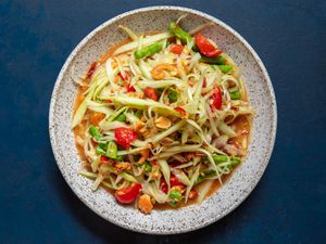 Overhead of a serving bowl of som tam Thai.