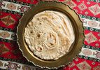 Stack of baked lavash on a serving platter