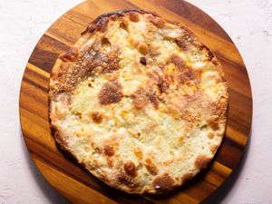 Overhead of a focaccia di Recco on a serving board