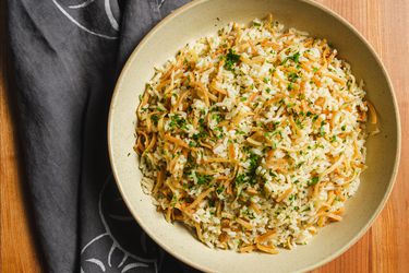 Overhead view of rice pilaf on a pale plate