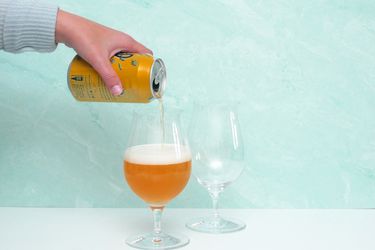 pouring beer into tulip glass