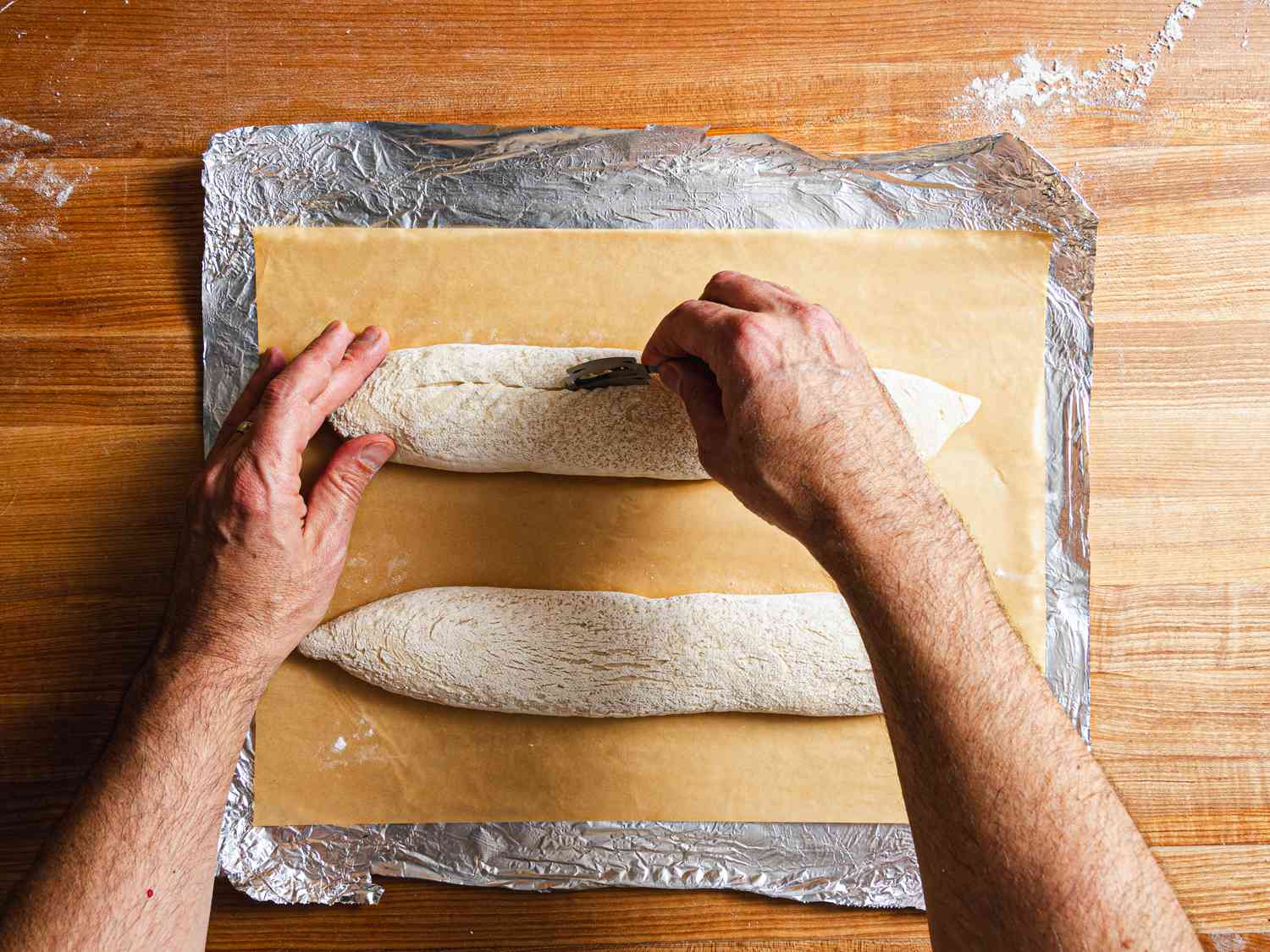 Overhead view of scoring the baguette