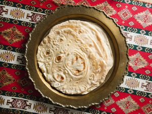 Stack of baked lavash on a serving platter