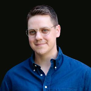 headshot of Jesse Raub against a black background